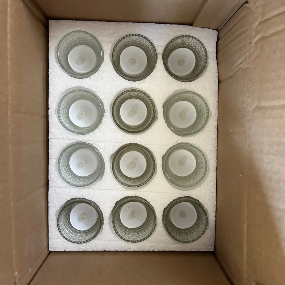 Set of 18 glass votive candle holders with tea lights